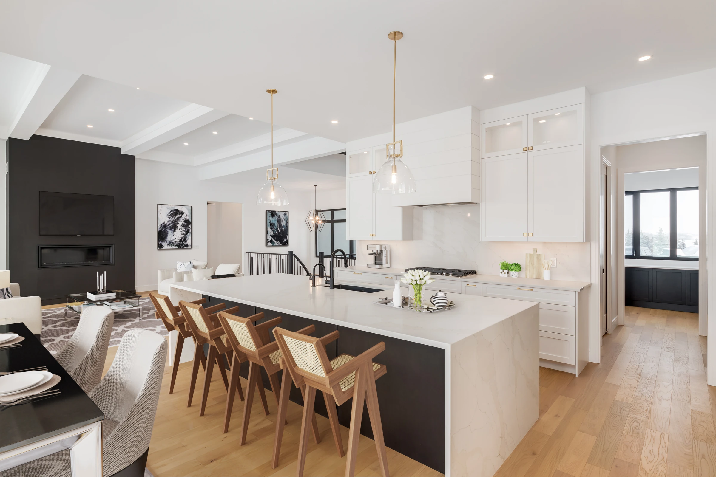 Open-concept living and dining area with a dark fireplace wall and wood beam ceiling