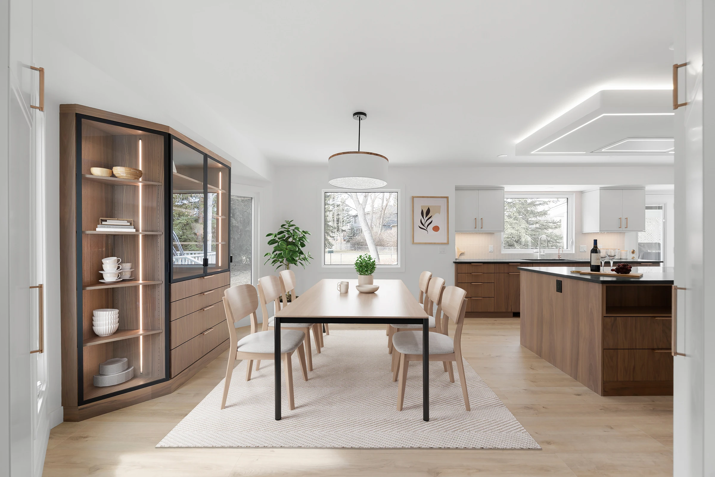 Virtually staged dining room with a built-in hutch opening to the kitchen
